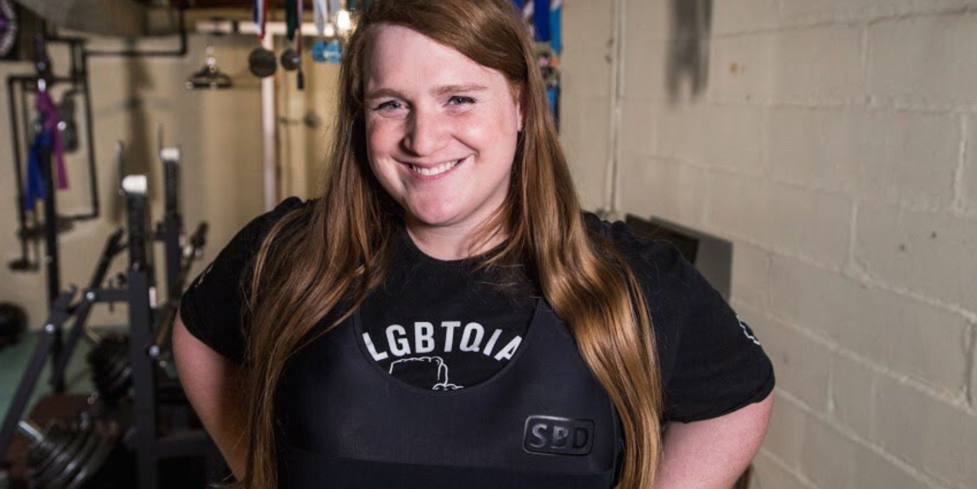 Trans powerlifter JayCee Cooper wins discrimination settlement after ban from sport