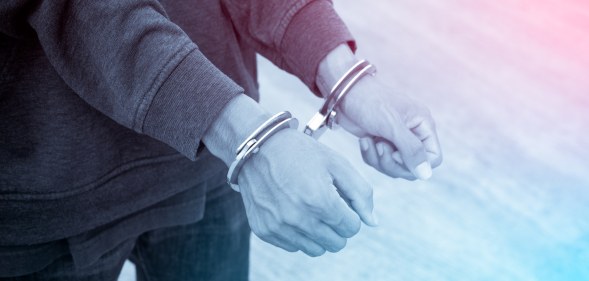 person with handcuffs