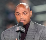 Charles Barkley appearing on NBA Tip-Off in a grey suit, holding the mic up to his mouth