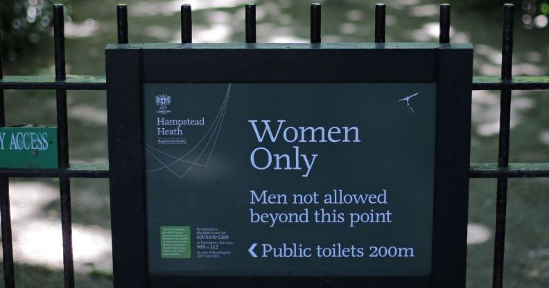 The sign indicating the 'Women Only' swimming pool is seen attached to gates on Hampstead Heath in central London