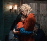 The Mysterious Gaze of the Flamingo still: a child hugging an adult