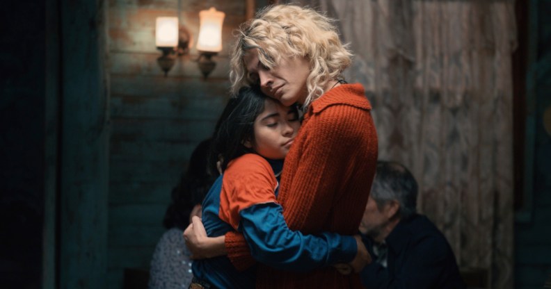 The Mysterious Gaze of the Flamingo still: a child hugging an adult