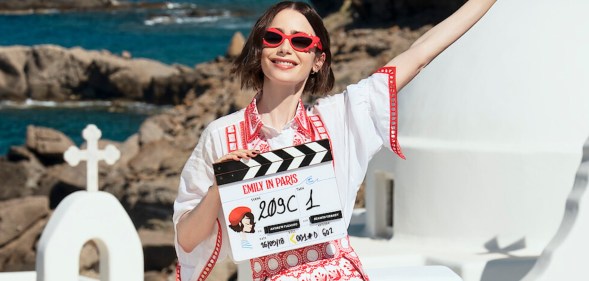 Emily in Paris star Lily Collins posing in Greece with a filming clapper board