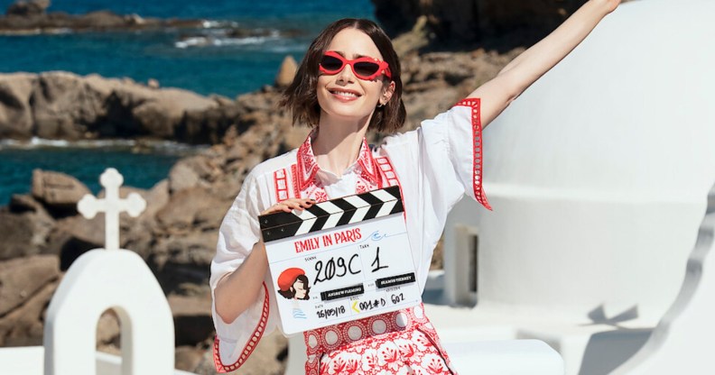 Emily in Paris star Lily Collins posing in Greece with a filming clapper board