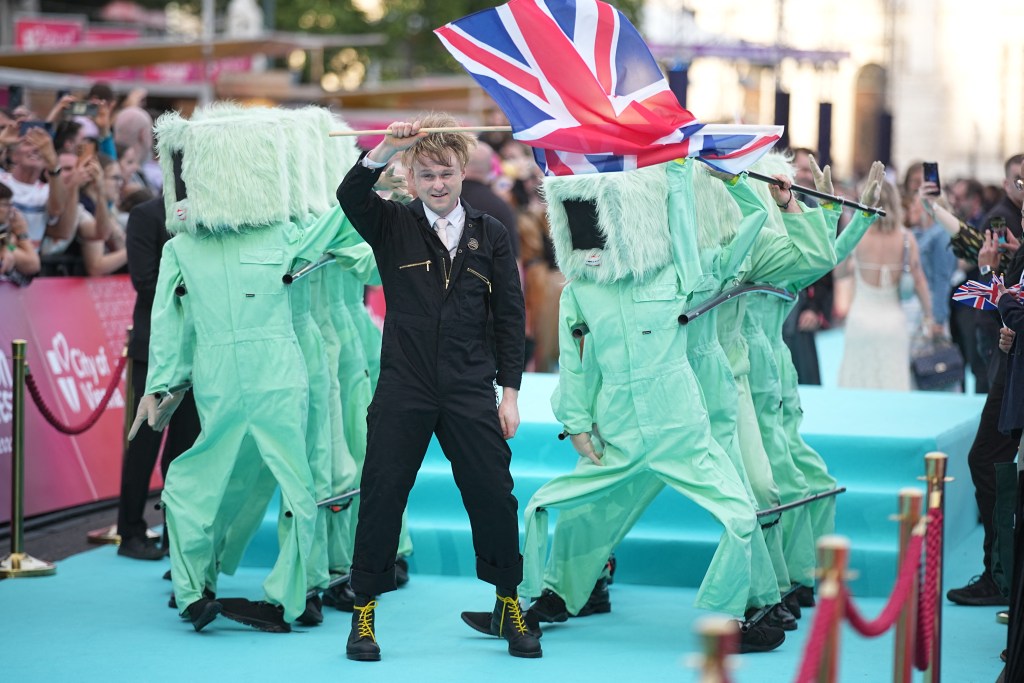 English musician Sam Battle, aka Look Mum No Computer and representing Great Britain with the song 'Eins, Zwei, Drei', pose for photographers on the turquoise carpet for the opening ceremony of the Eurovision Song Contest 2026