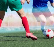 two footballers with trans pride colours