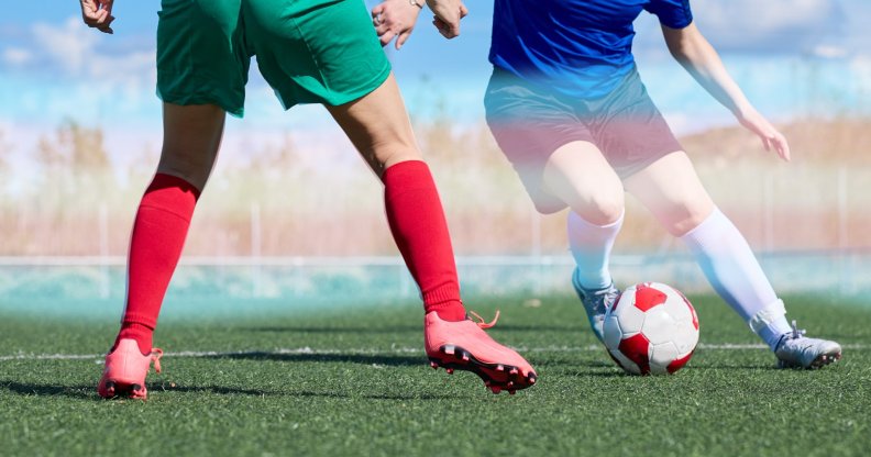 two footballers with trans pride colours
