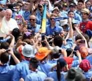 The late Pope Francis meets with members of the Association of Italian Catholic Guides and Scouts (AGESCI) in 2015