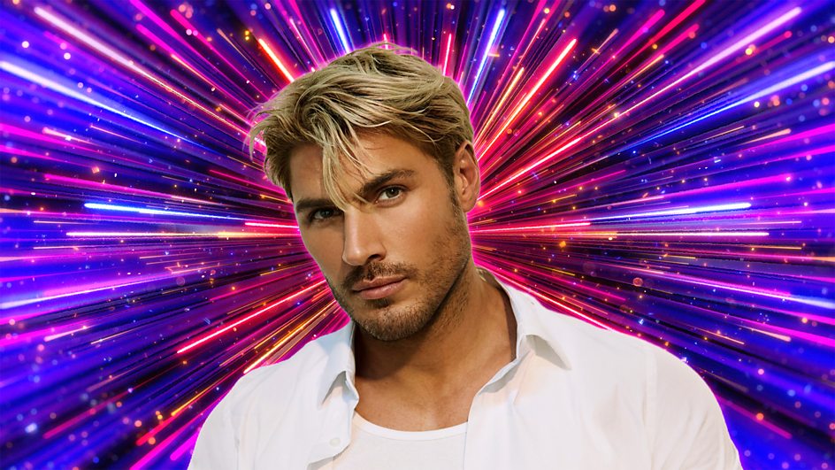 Chris Appleton in front of a colourful firework explosion
