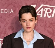 Emma Corrin at Variety 2026 Power of Women London. They're wearing a pale blue shirt under a brown suit