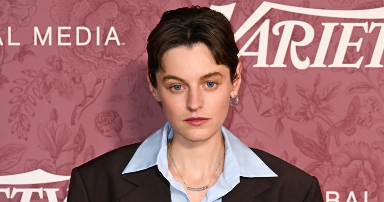 Emma Corrin at Variety 2026 Power of Women London. They're wearing a pale blue shirt under a brown suit
