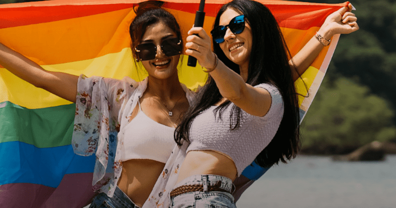 The majority of LGBTQ+ people are staying in the closet abroad, a new survey shows. (Envato)