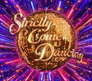 colourful explosion behind the Strictly Come Dancing golden glitter ball