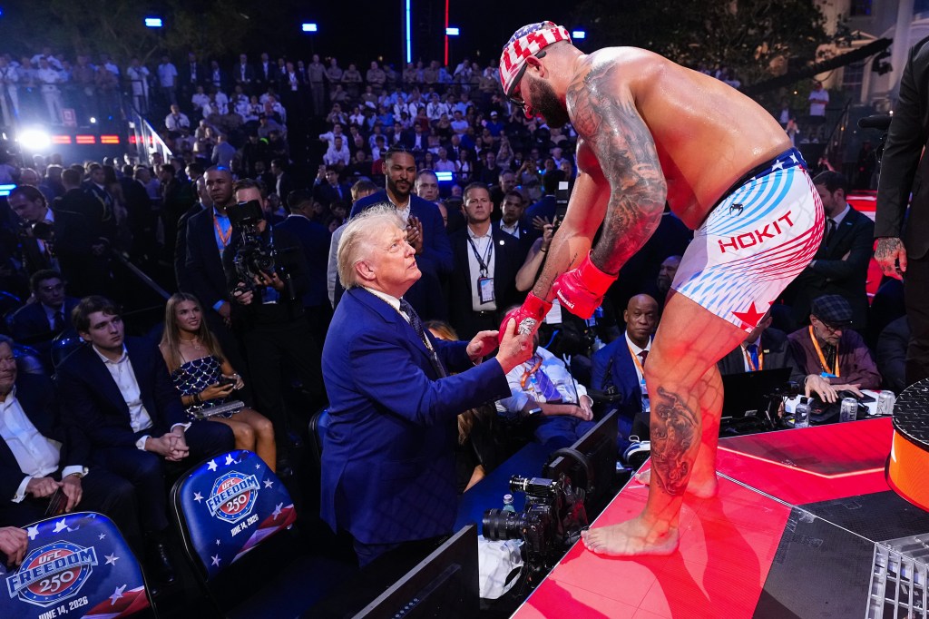 (R-L) Josh Hokit speaks with U.S. President Donald J. Trump following his win in a heavyweight fight during the UFC Freedom 250 event on the South Lawn at the White House