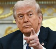 Donald Trump pointing towards the camera.