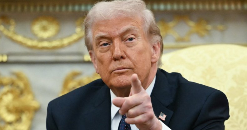 Donald Trump pointing towards the camera.