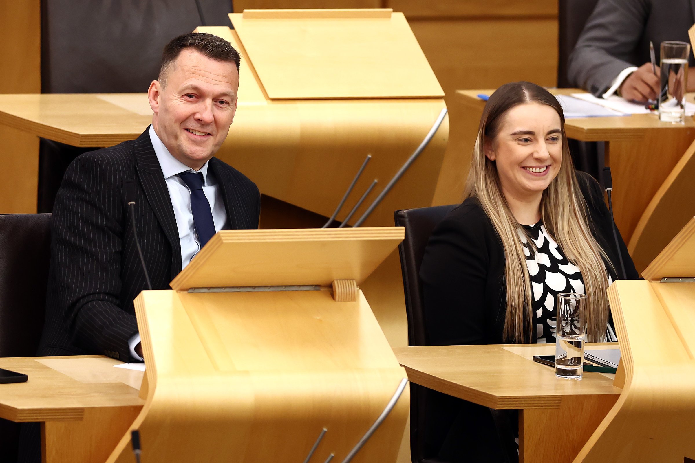 EDINBURGH, SCOTLAND - SEPTEMBER 26: Scottish Conservative party leadership candidates Russell Findlay MSP and Meghan Gallacher MSP attend First Minister's Questions at Scottish Parliament Building on