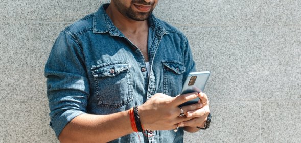 indian man using phone