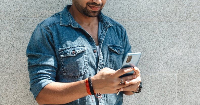 indian man using phone