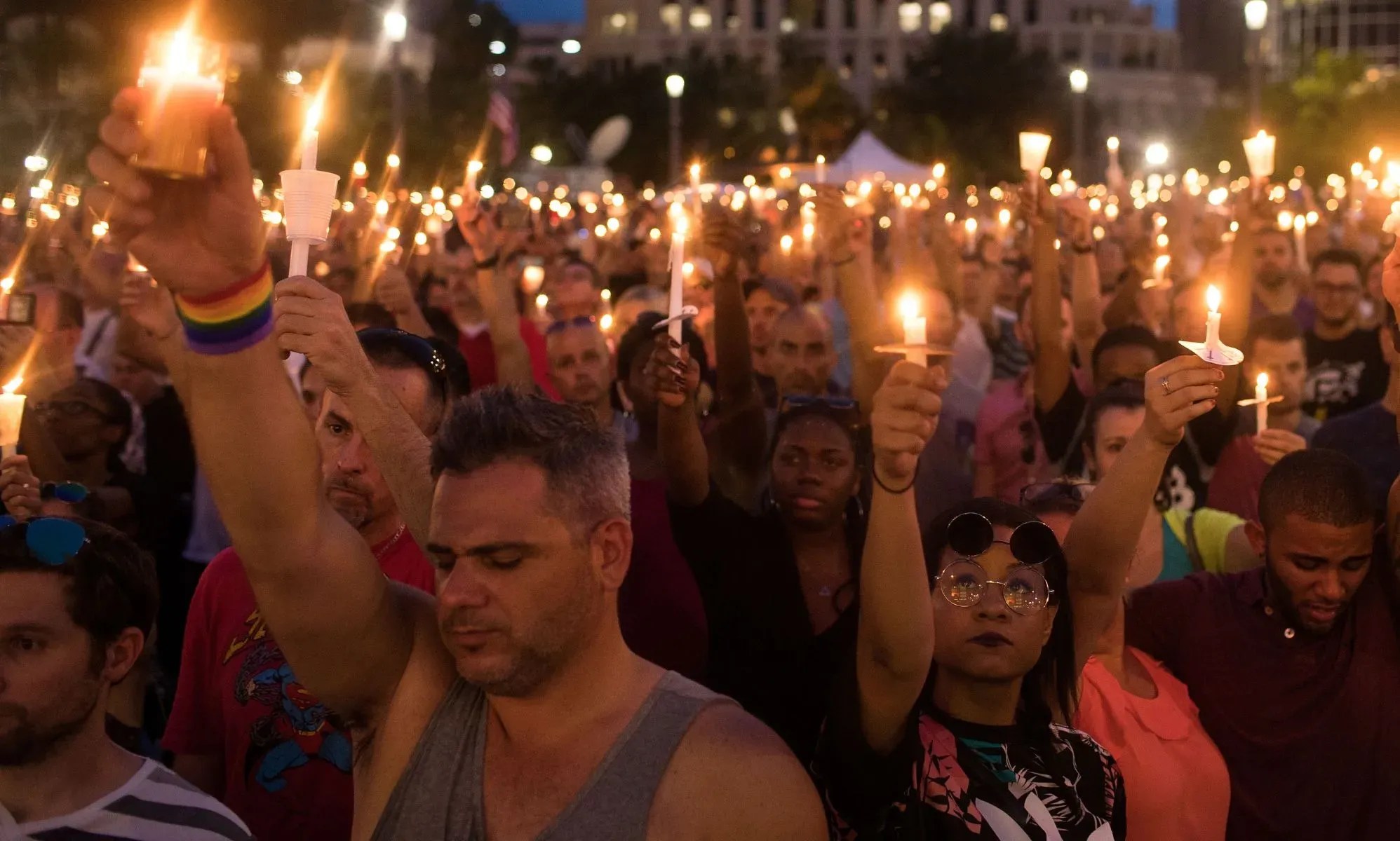 Crowds holding candles at a vigil for those killed in the Pulse shooting. (Getty)