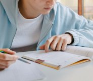 a teen using a revision guide