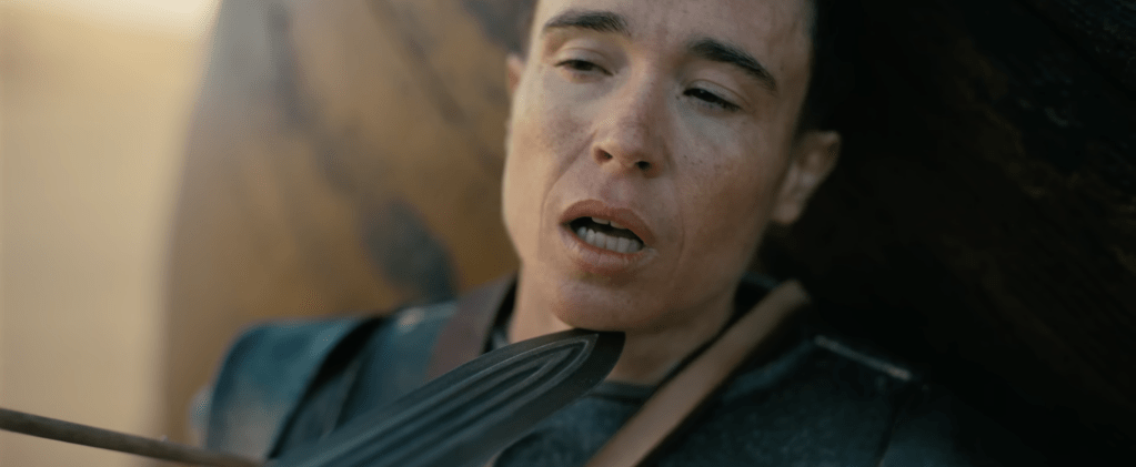 Elliot Page in The Odyssey; a sword held up to his face