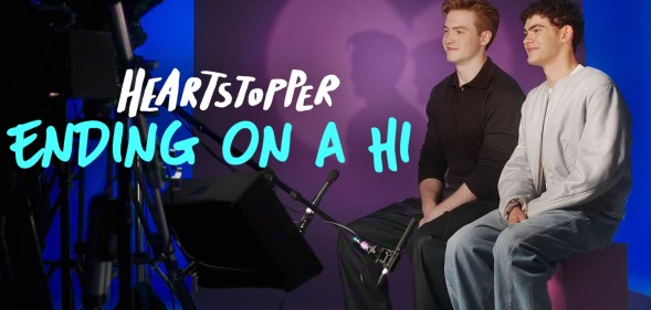 Heartstopper: Ending on a Hi still: Kit Connor and Joe Locke sat on set