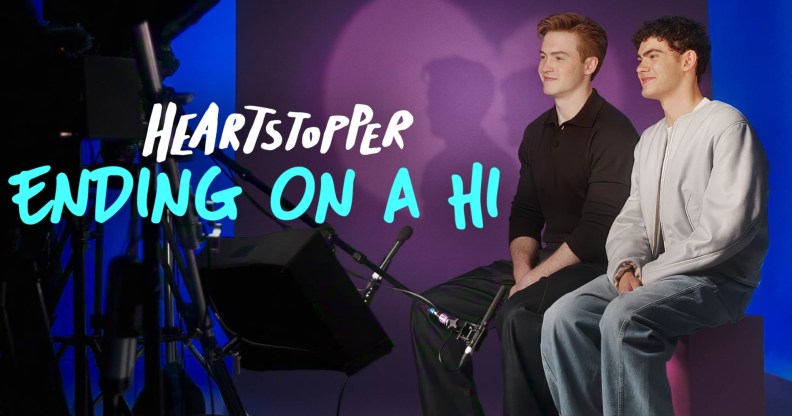 Heartstopper: Ending on a Hi still: Kit Connor and Joe Locke sat on set