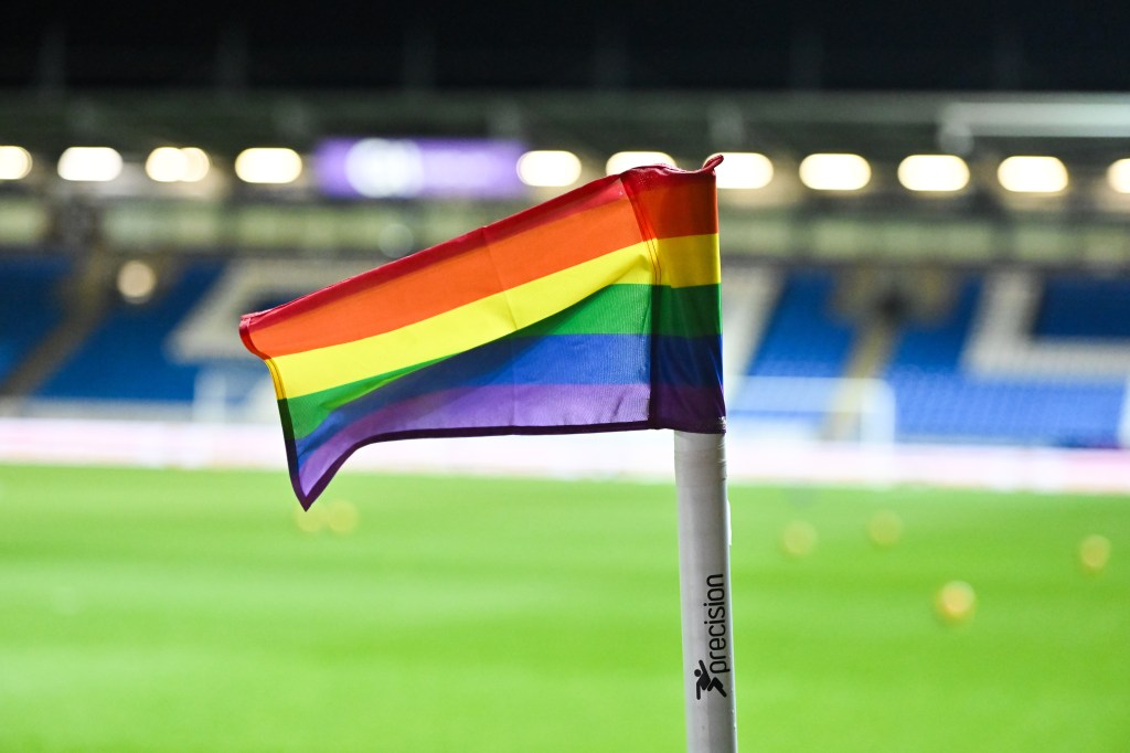 A rainbow flag was planted on the soccer field.