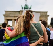 People gather at the Brandenburg Gate in a memorial of the Berlin pride attack