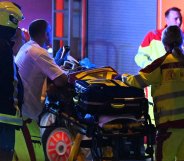 Emergency personnel and police work near the scene where one person was killed and around 15 injured after a car is believed to have hit the crowd on the outskirts of the Christopher Street Day (CSD)