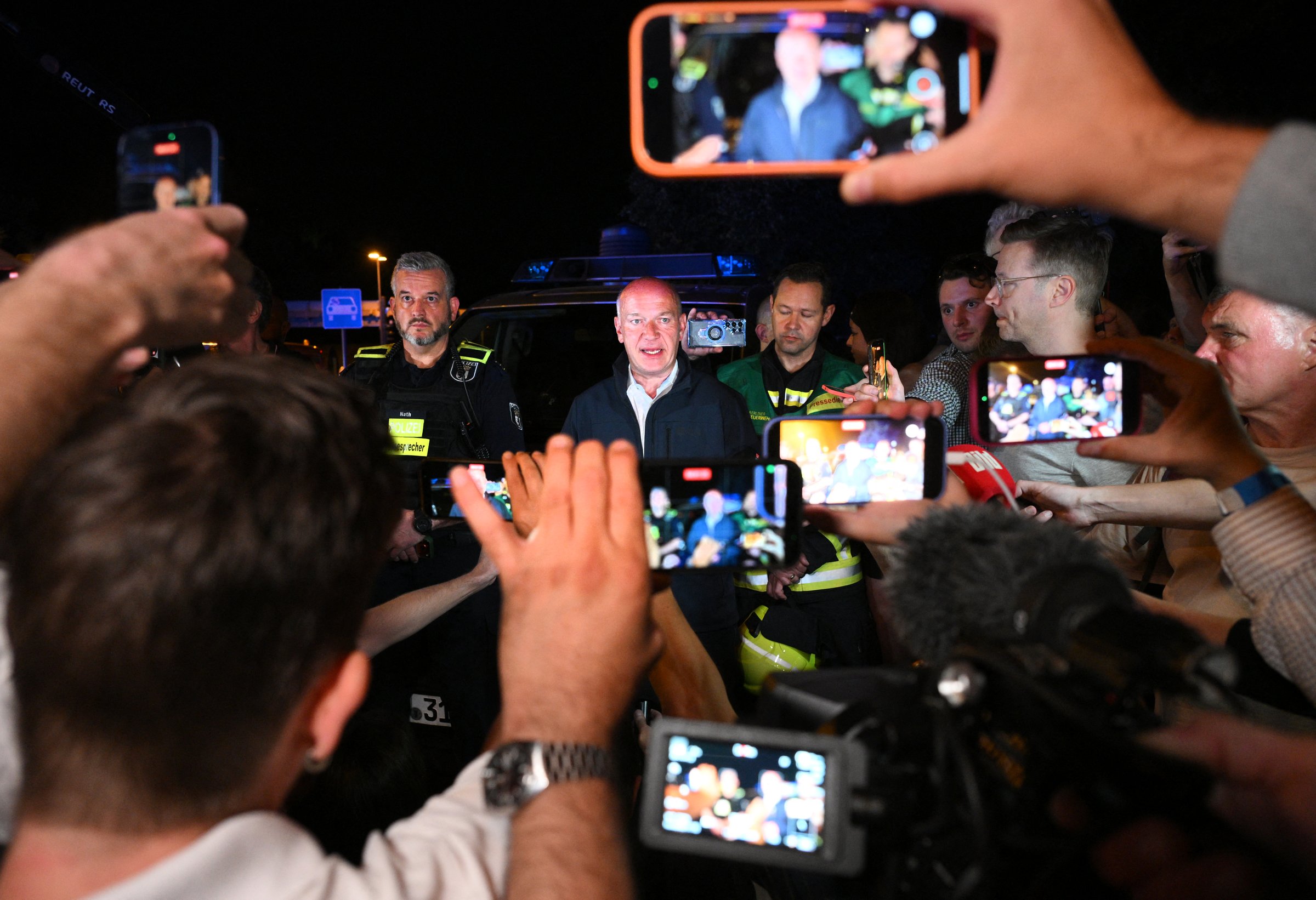 Berlin's mayor Kai Wegner speaks to the media near the scene where one person was killed and around 15 injured after a car is believed to have hit the crowd on the outskirts of the Christopher Street