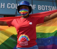 Activists carry a rainbow flag outside the Botswana High Court on October 12, 2021