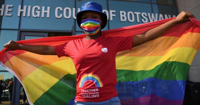 Activists carry a rainbow flag outside the Botswana High Court on October 12, 2021