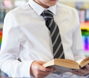 a school student reading a book