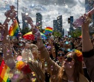 Participants blow soap bubbles as they celebrate at the Warsaw Pride parade in 2026