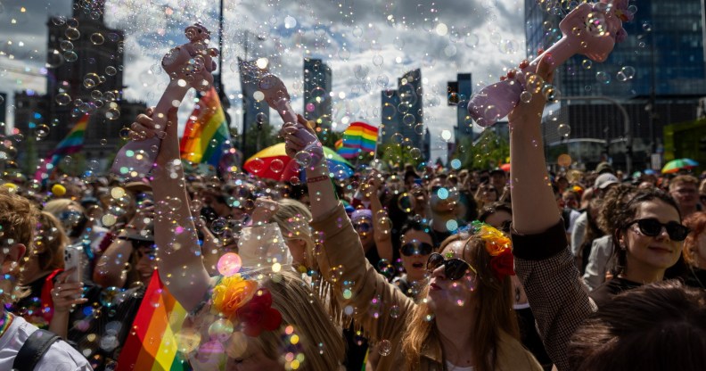 Participants blow soap bubbles as they celebrate at the Warsaw Pride parade in 2026