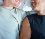 two men in bed