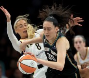 Sophie Cunningham #8 of the Indiana Fever is called for a foul as she collides with Breanna Stewart #30 of the New York Liberty