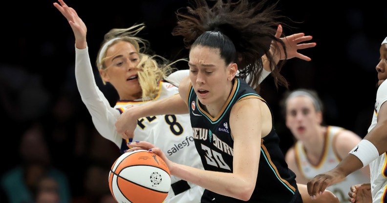 Sophie Cunningham #8 of the Indiana Fever is called for a foul as she collides with Breanna Stewart #30 of the New York Liberty