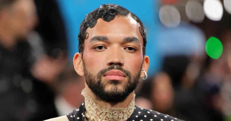 Justice Smith posing at the Met Gala