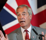 Reform UK Leader Nigel Farage attend a press conference, union jack flag behind him
