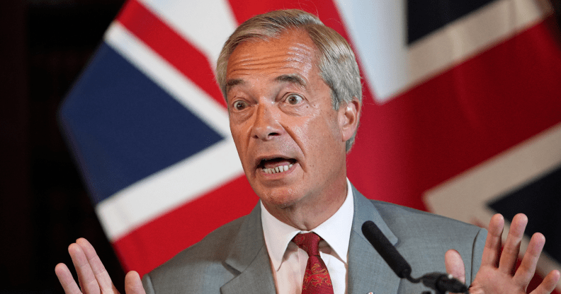 Reform UK Leader Nigel Farage attend a press conference, union jack flag behind him