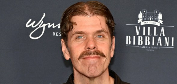 Perez Hilton against black background