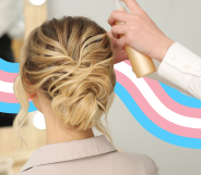A woman having her hair done at a salon with a trans flag banner behind her.