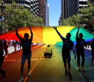 Marchers carry an oversized Pride flag during the 52nd annual San Francisco Pride Parade