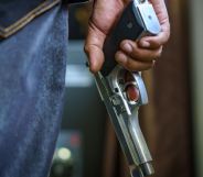 a man holding a gun