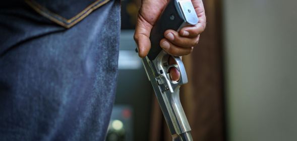 a man holding a gun