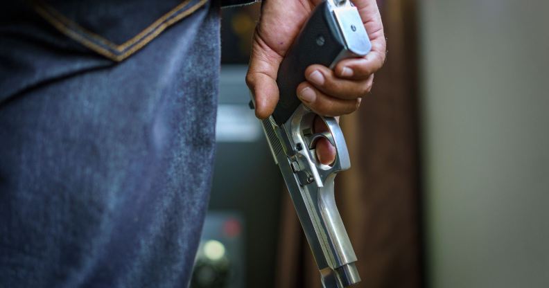 a man holding a gun