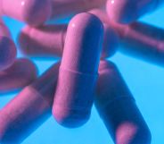 pink pills on a blue background